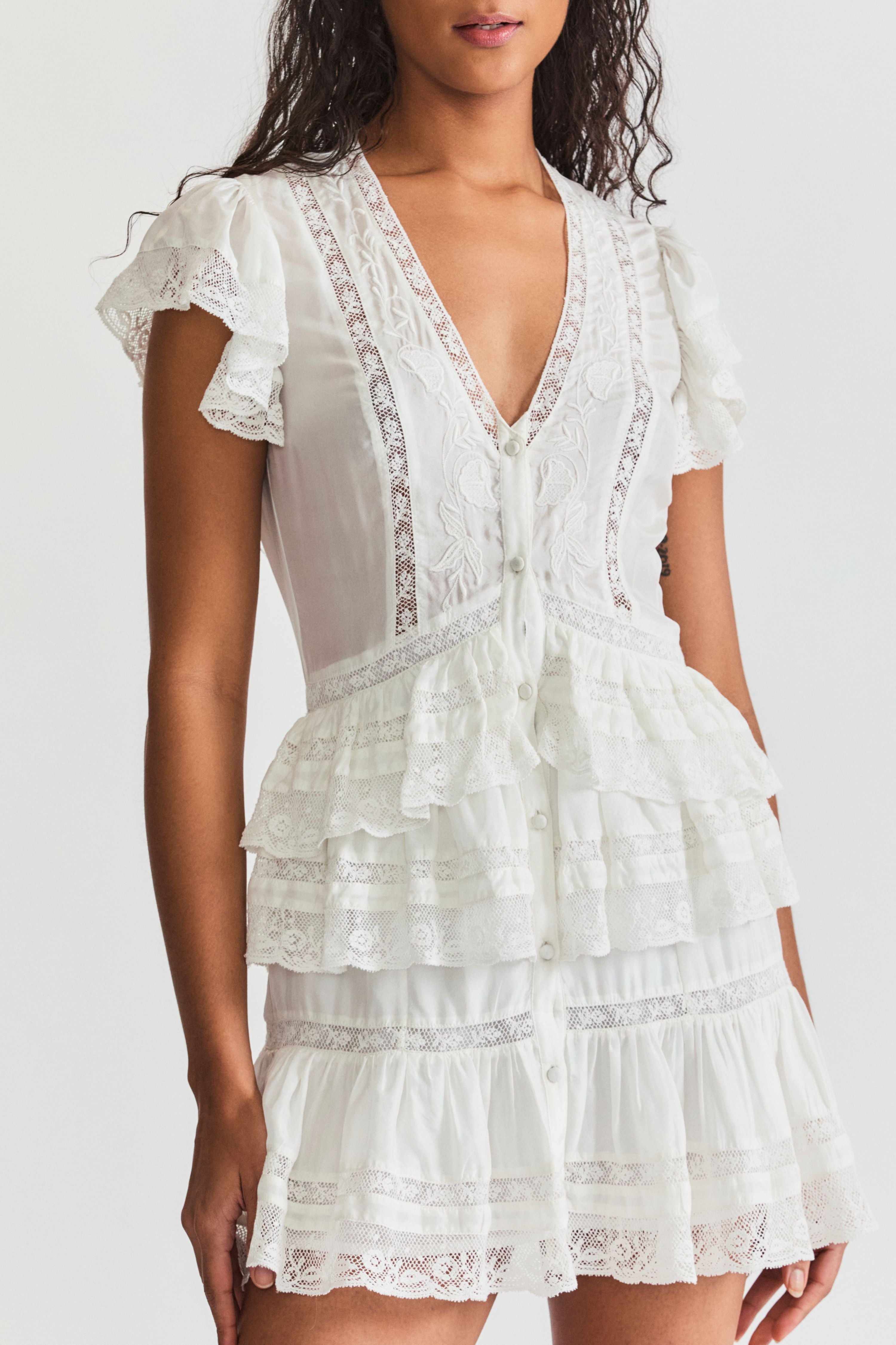 LoveShackFancy Kindler dress. Short sleeve v-neck summer short dress with flutter cap sleeves and lace detailing.