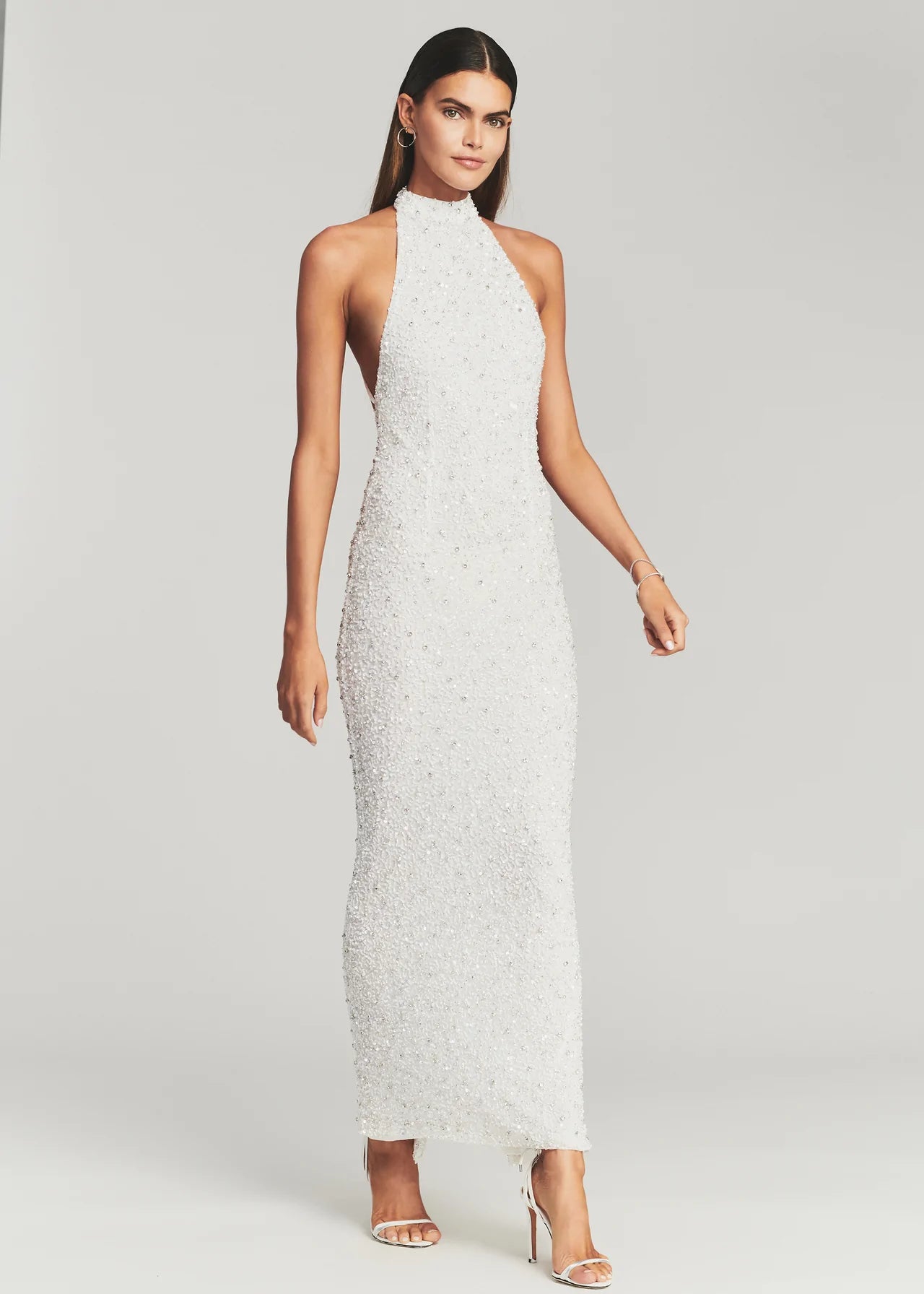 Retrofete Olivia dress. Floor length beaded white halter gown with open low back.