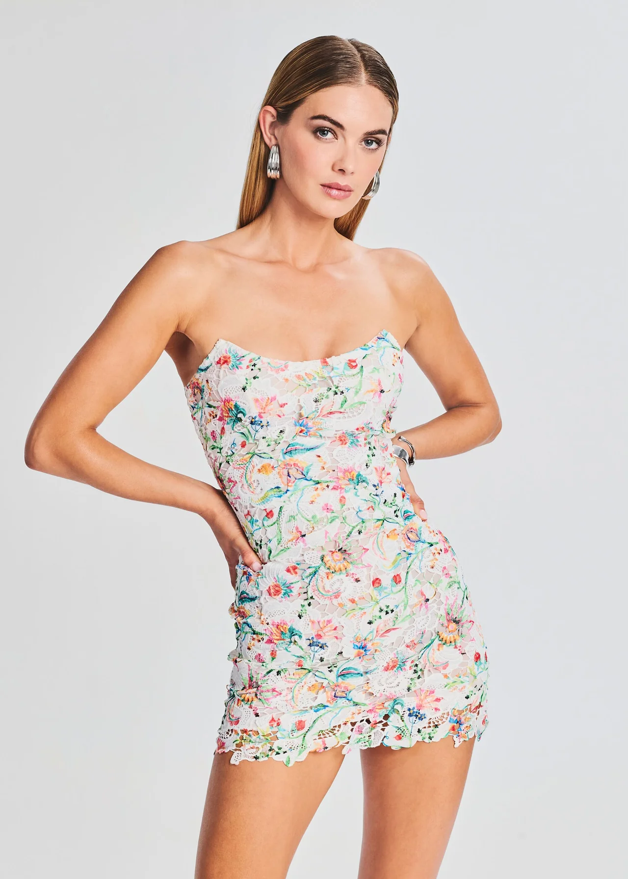 Rococo Sand mini white lace strapless scoop neck dress with colorful floral print. 